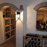 Wine cellar, © Besta Betriebs GmbH A wine cellar with bottle racks and brick arches.