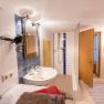 Bath and shower, © Wachahof A bathroom with washbasin, mirror, shower and towels.