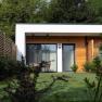 The guest house in the Triad, © Marketing Platzhirsch, Gobauer Modern guest house with wood paneling and garden.