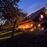 Vacation home at night, © www.360perspektiven.at An illuminated vacation home at night with garden and sun lounger.