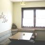 Dining table in the kitchen, © Anke Spreitzer Kitchen with corner bench, table and 'Kreativ Labor' lettering on the wall.
