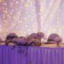 Outdoor pool, © Besta Betriebs GmbH Elegant table decoration with candlesticks and flowers in front of fairy lights.