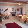 Wedding ceremony in the garden, © Besta Betriebs GmbH Cozy guest room with wooden furniture and fireplace.