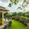 View of the area, © Wiener Alpen/Martin Fülöp Garden with sun loungers and views of a green landscape.