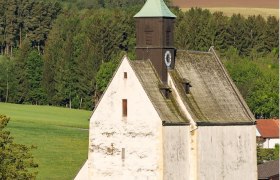 Fortified church Bad Schönau in front of a green landscape.