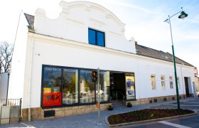 A white building with shop windows