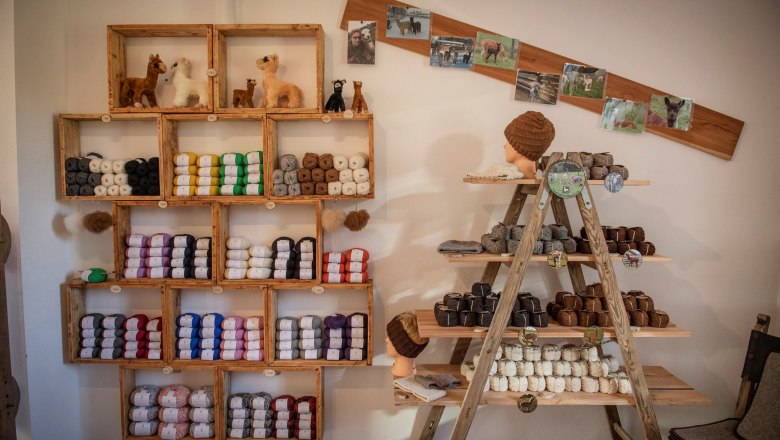 Interior view of a farm store with alpaca wool and knitwear.