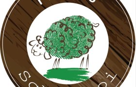 Hackl's Schofstoi logo with a sheep drawn from a fingerprint on a wood-effect background.