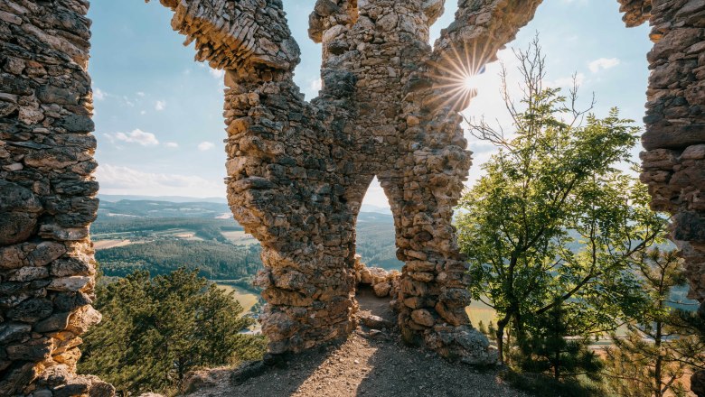 Ruin Türkensturz with a view of the landscape and sunrays through the wall.